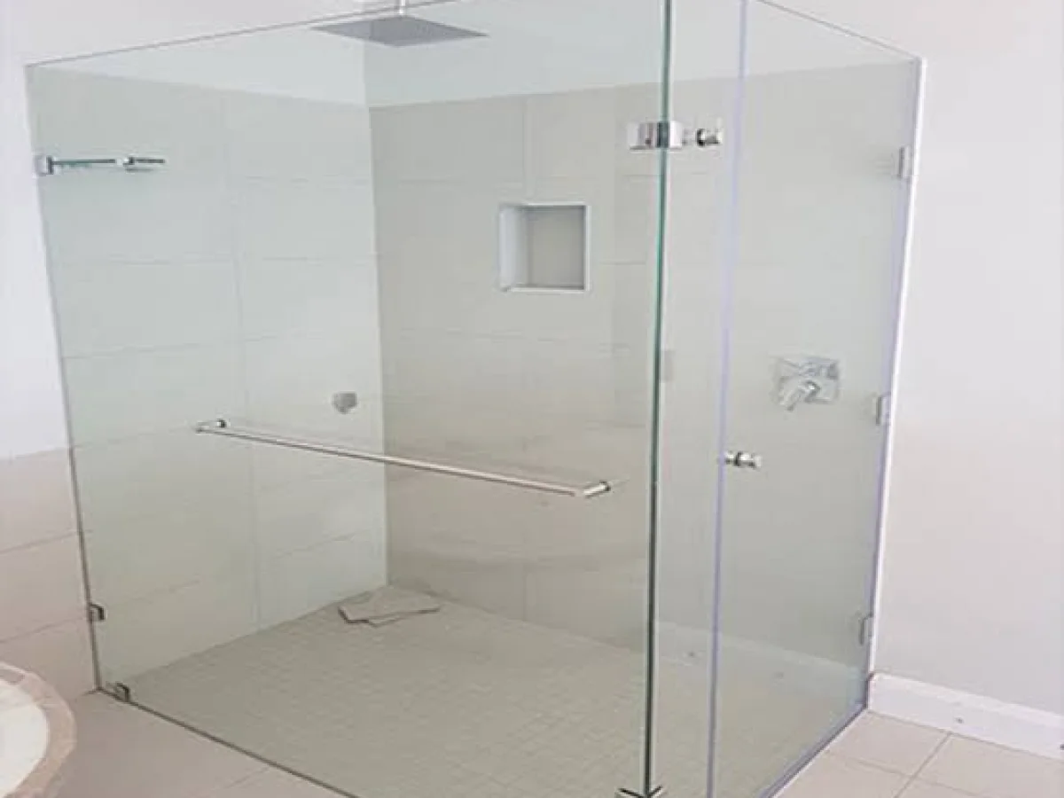 Frameless shower installations